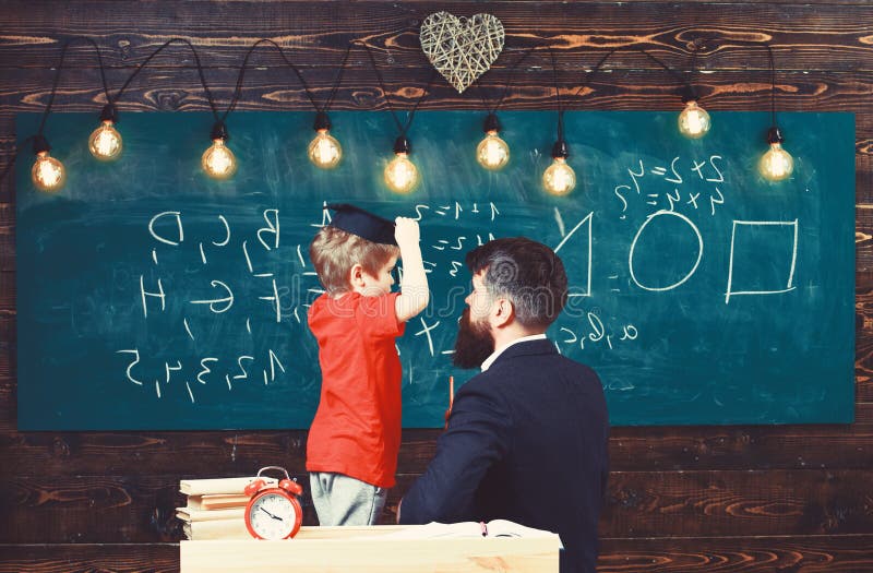 His father a teacher. School class with Kids Chalkboard view.