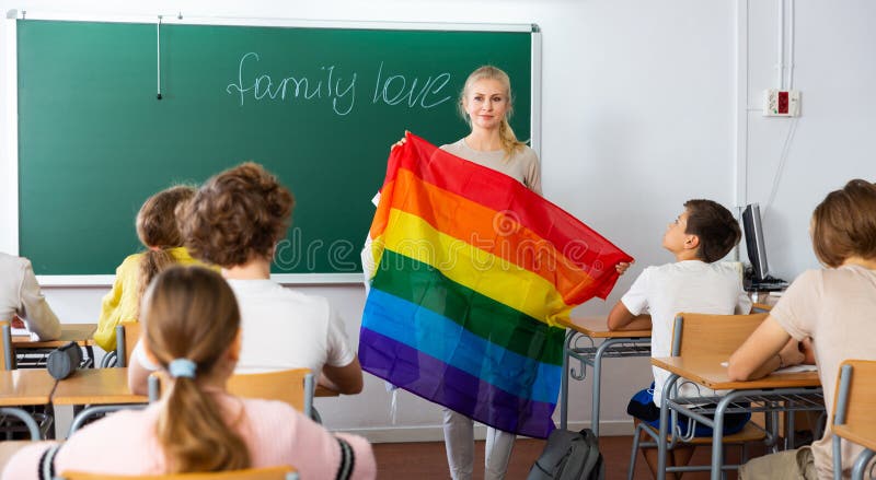 Teacher explaining lgbt theme to children during lesson
