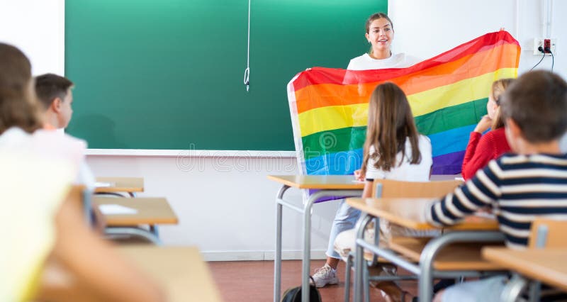 Teacher explaining meaning of LGBT flag to kids in school