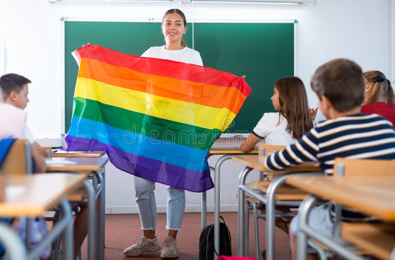 Teacher explaining meaning of LGBT flag to kids in school