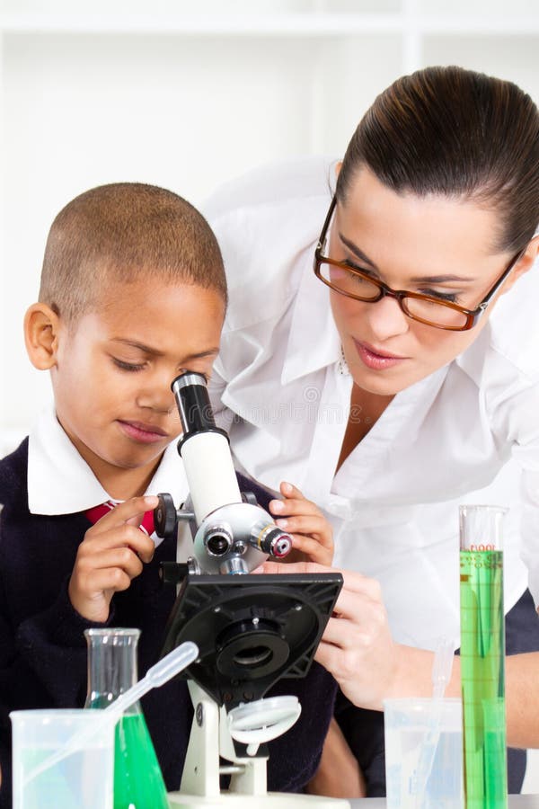 Teacher helping school boy royalty free stock photography