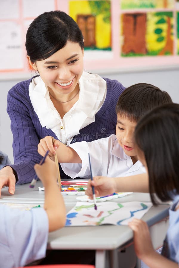 Teacher Helping Students During Art Class. Creativity, encouraging.