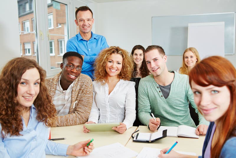 Teacher with students in college