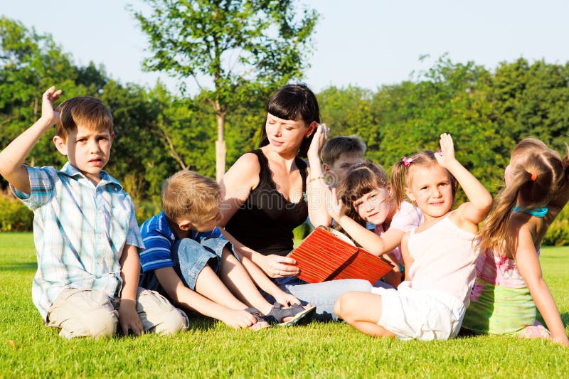 Teacher and kids stock images