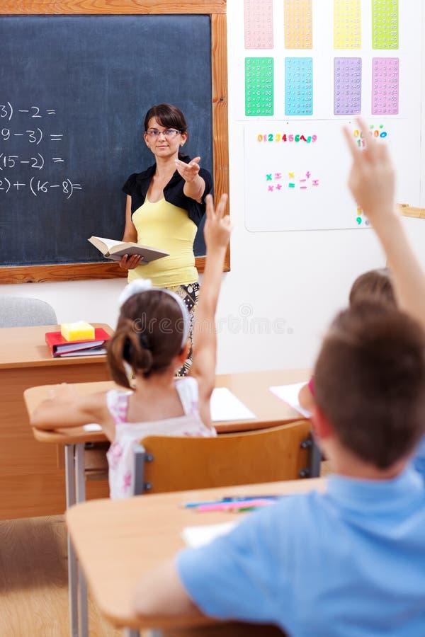 Teacher pointing at students royalty free stock photos
