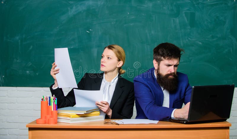 Teacher and student on exam. back to school. Formal education. businessman and secretary. paper work. office life royalty free stock images