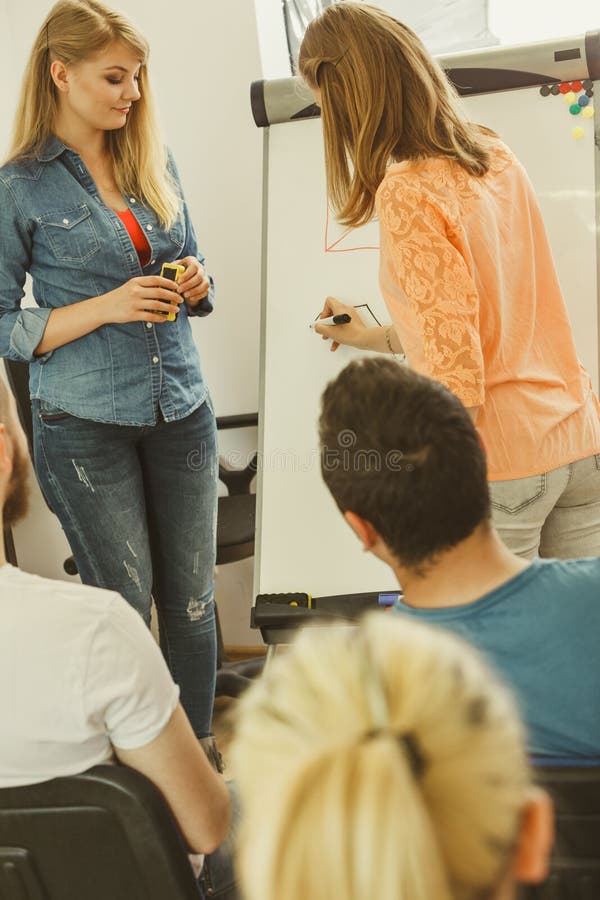 Teacher teaching mathematics to college students stock photography Teacher teaching mathematics to college students stock photography