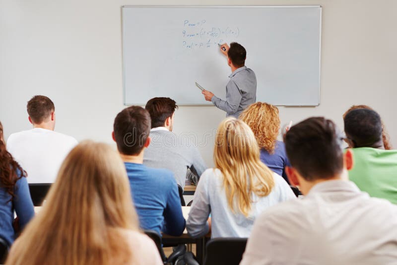 Teacher On Whiteboard In Class Stock Photo Image of academy, lessons