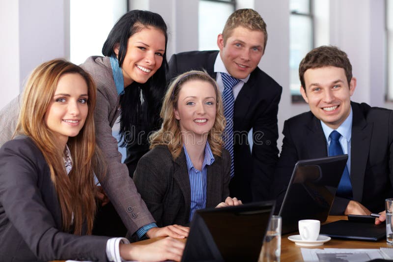 Team of 5 business people during meeting