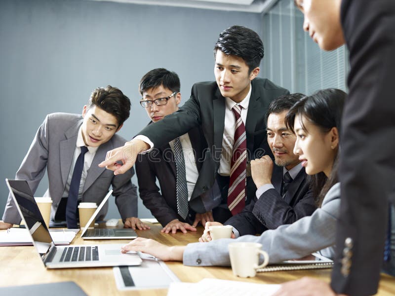 Team of asian business people working together in office