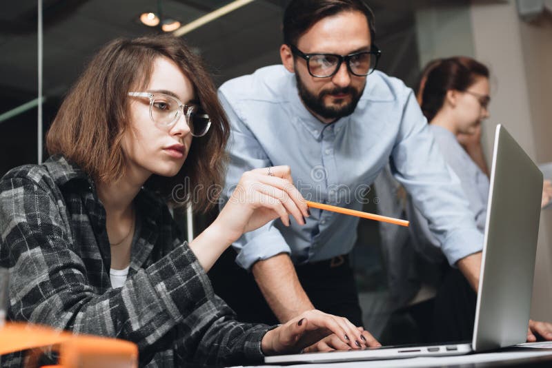 Team brainstorming. Business team of women and men in process of royalty free stock images Team brainstorming. Business team of women and men in process of royalty free stock images