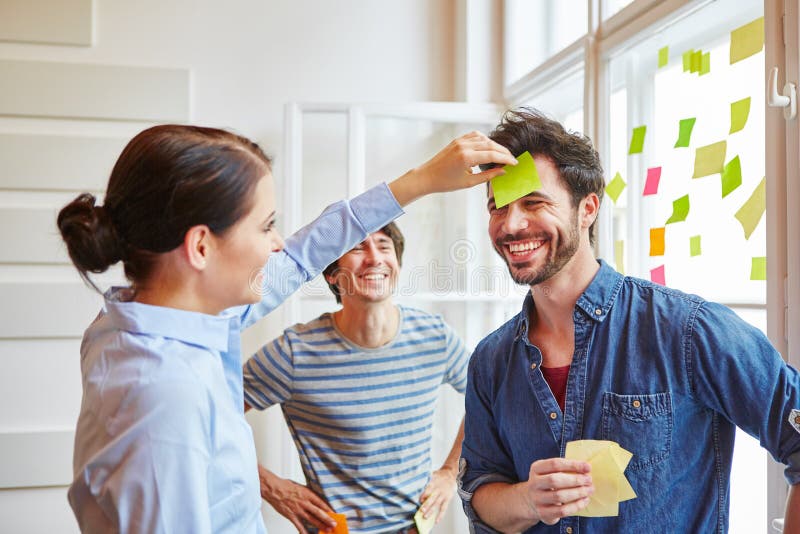 Team building game with sticky notes stock image