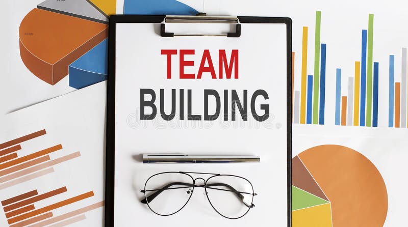 TEAM BUILDING text. Conceptual background with chart ,papers, pen and glasses royalty free stock photos