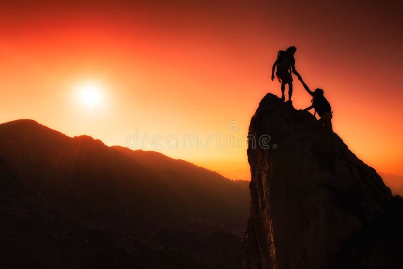 Team of climbers help to conquer the summit royalty free stock photo Team of climbers help to conquer the summit royalty free stock photo
