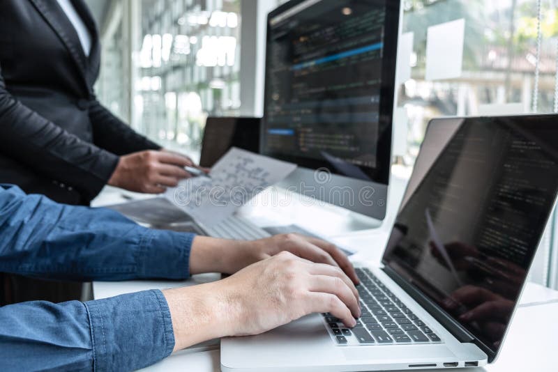 Team of developer programmer working on project in software development computer in IT company office, Writing codes and data code website and coding database technologies to find problem solution. Program coding working stock images, royalty-free photos and pictures