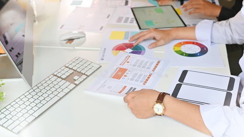 Team developer ux ui designer creative graphic planning application development a prototype smartphone application layout. royalty free stock photo
