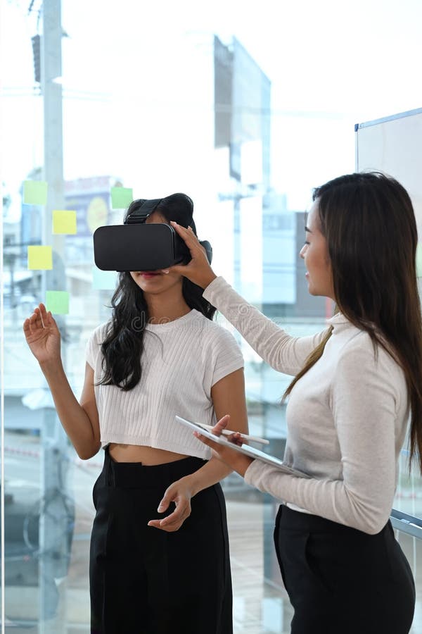 Team of Developers Testing Virtual Reality Headset, Brainstorming on