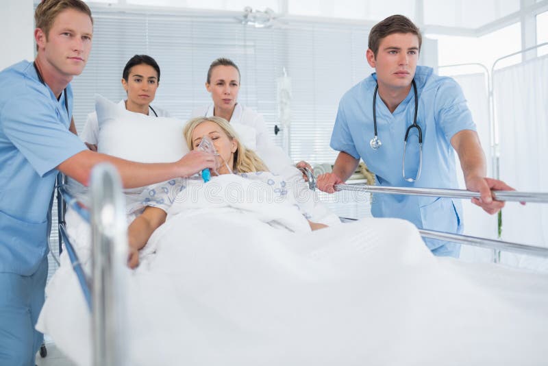 Team of Doctors Carrying Patient on Stretcher Stock Photo Image of