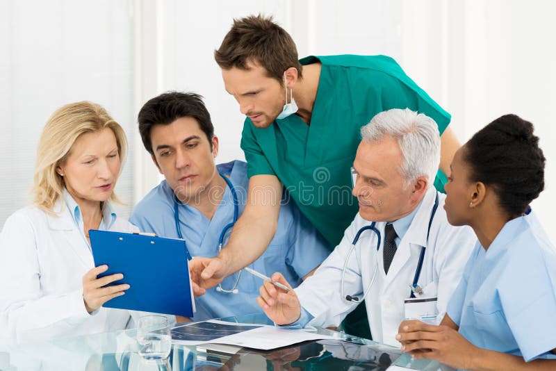 Team Of Experts Doctors Examining Medical Exams. Team Of Experts Doctors Examining Medical Exams