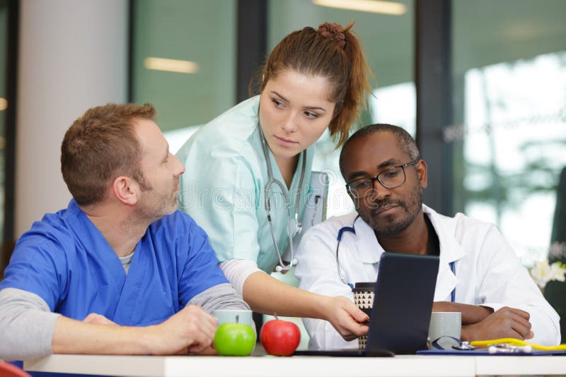 Team doctors having lunch stock photo. Image of specialist 261157110