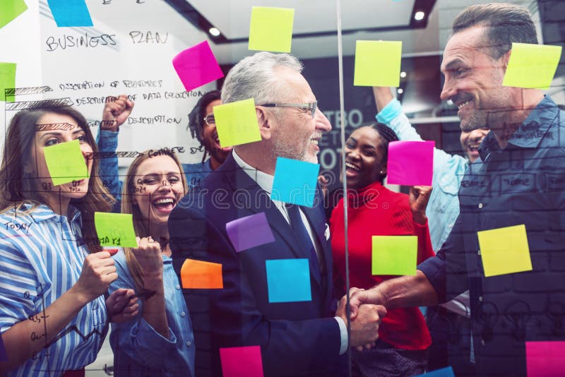 Team of happy people work together. concept of teamwork, partnership and success stock photography Team of happy people work together. concept of teamwork, partnership and success stock photography