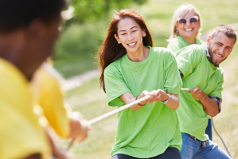 Team Has Fun Together in Tug of War Stock Image - Image of cooperation ...