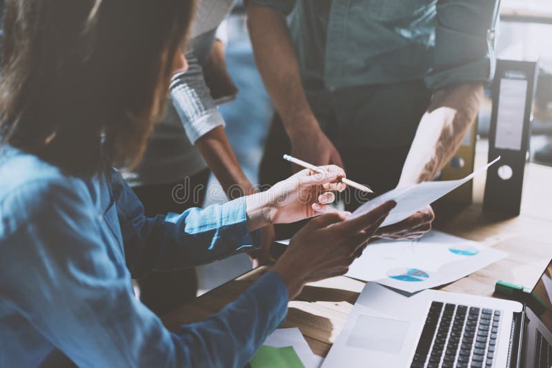 Team job succes. Photo young business managers working with new startup project in office. Analyze document, plans royalty free stock photo Team job succes. Photo young business managers working with new startup project in office. Analyze document, plans royalty free stock photo