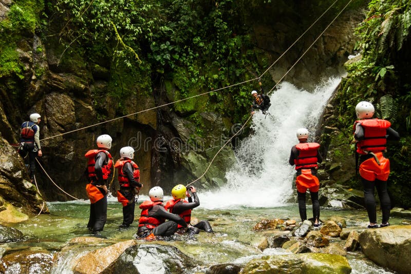 Team Of Mixed People On Canyoning Adventure