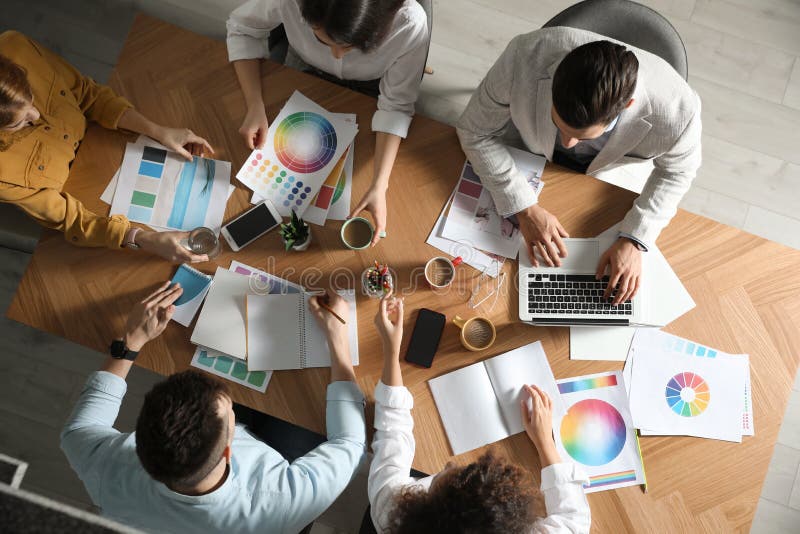 Team of professional designers working at table, top view. Team of professional designers working together at table, top view royalty free stock photo Team of professional designers working at table, top view. Team of professional designers working together at table, top view royalty free stock photo