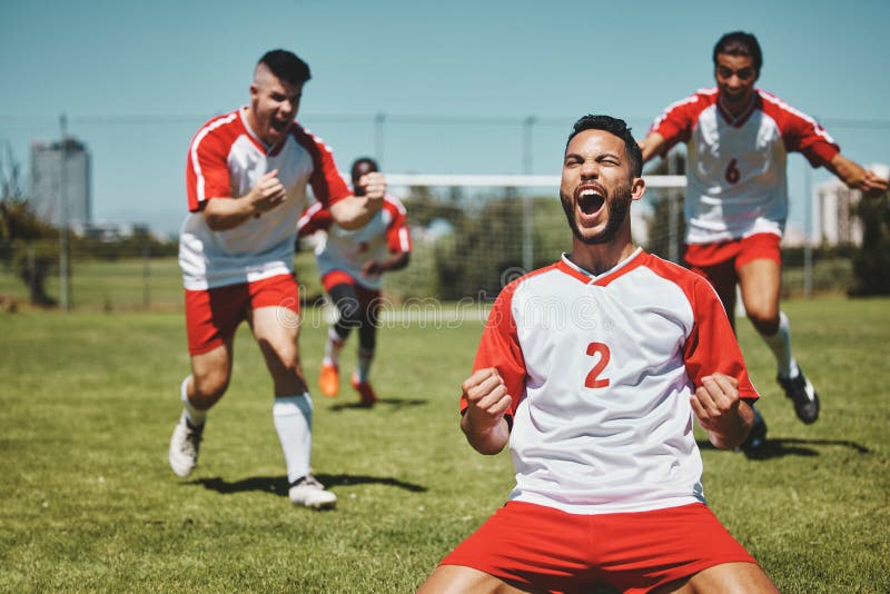 Team Success And Winner By Soccer Player Celebration During Game At team-success-and-winner-by-soccer-player-celebration-during-game-at