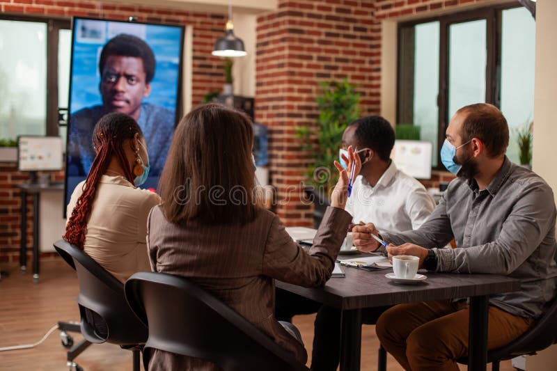 Team in virtual meeting with employer royalty free stock photo