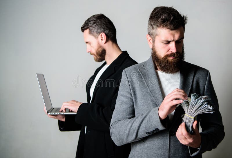 Team of web developer with laptop and sales manager with cash money. Developing applications. Digital technology. IT stock image