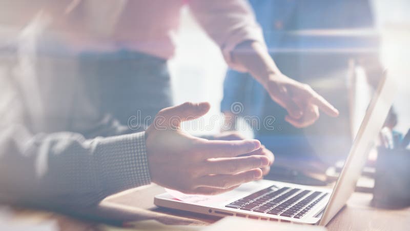 Team work. New project discussing. Startup crew in office. Film effect and lens flare effect stock photo Team work. New project discussing. Startup crew in office. Film effect and lens flare effect stock photo