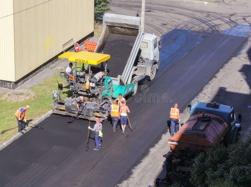 A Team Working on the Road Machinery. Editorial Photo Image of