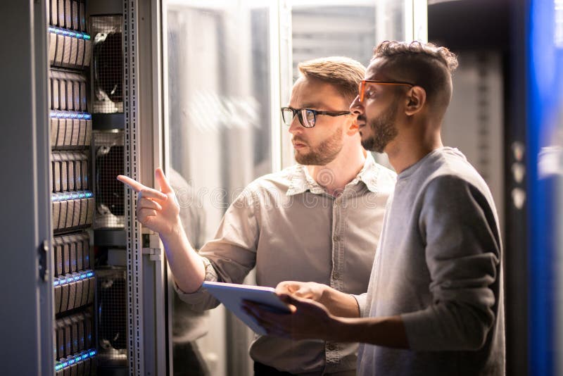 Team of specialists managing network server royalty free stock photography Team of specialists managing network server royalty free stock photography