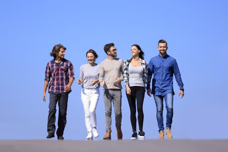 Team of young people walking along the road.outdoors royalty free stock photo Team of young people walking along the road.outdoors royalty free stock photo