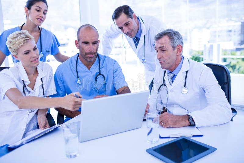 Teams of Doctors Working on Laptop Computer Stock Image Image of