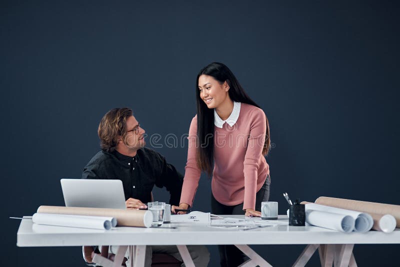 Teamwork, architecture or discussion in office with laptop for planning, remodeling papers or building ideas stock photos