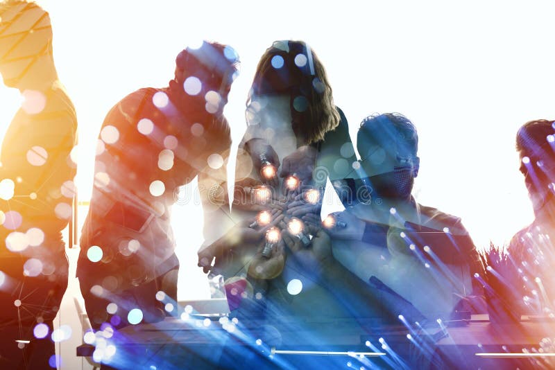 Teamwork and brainstorming concept with businessmen that share an idea with a lamp. Concept of startup. royalty free stock photography Teamwork and brainstorming concept with businessmen that share an idea with a lamp. Concept of startup. royalty free stock photography