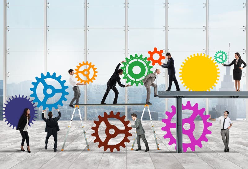 Teamwork of businesspeople work together to a system of gears as integration concept royalty free stock photo
