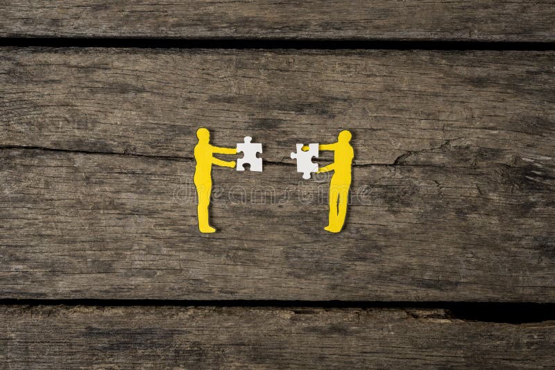Teamwork concept using paper cutout men stock photo