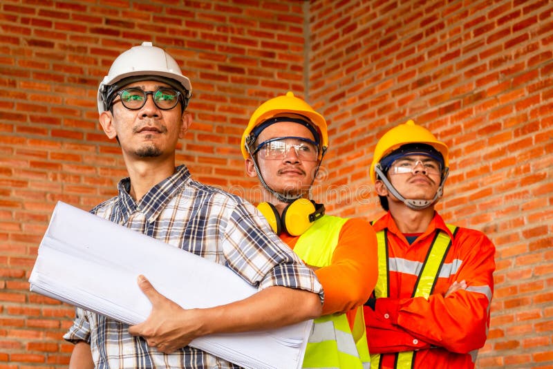 Teamwork Construction Worker Control in the House Structure at Construction Site Stock Photo