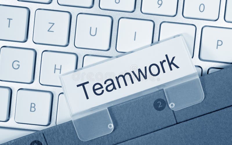 Teamwork - folder on computer keyboard stock photography Teamwork - folder on computer keyboard stock photography
