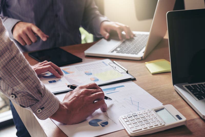 Teamwork process, Business team two managers colleagues discussing and analysis new plan financial graph data and marketing stock photo