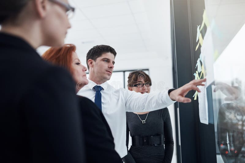 Teamwork, reading and planning of group, glass and collaboration of colleagues and ideas. Communication, brainstorming royalty free stock photo