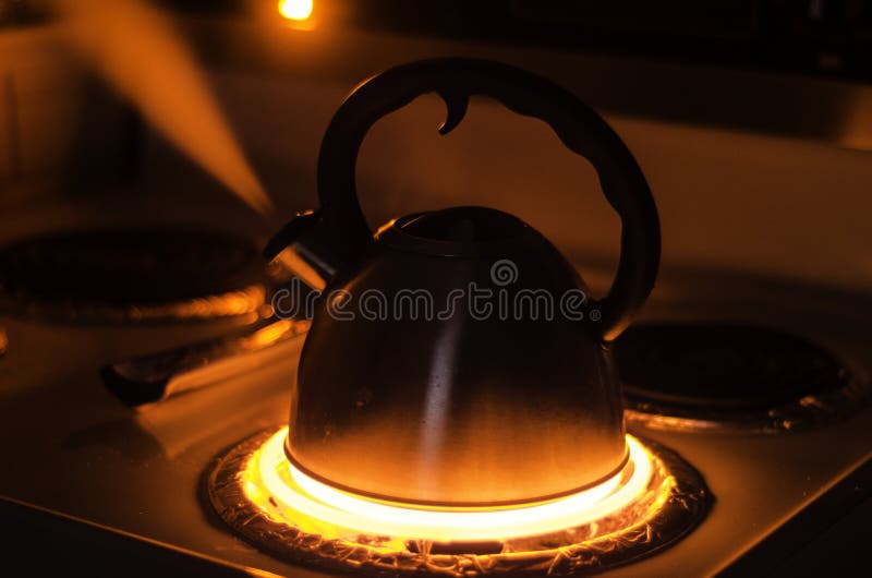 https://thumbs.dreamstime.com/b/teapot-boiling-steam-stove-dark-room-being-lit-glow-stove-30744300.jpg
