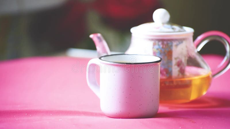 Teapot and a cup of hot tea video still life, time to have a drink