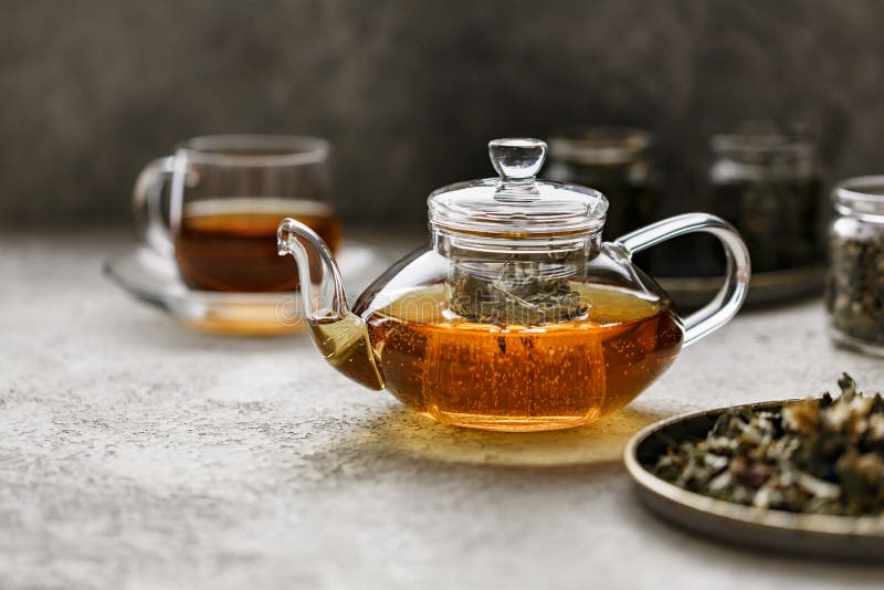 Teapot with Tea and Fresh Leaves Stock Image Image of breakfast, herbs 16790545