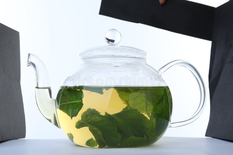 Teapot with Hot Aromatic Mint Tea Isolated on White Stock Photo Image
