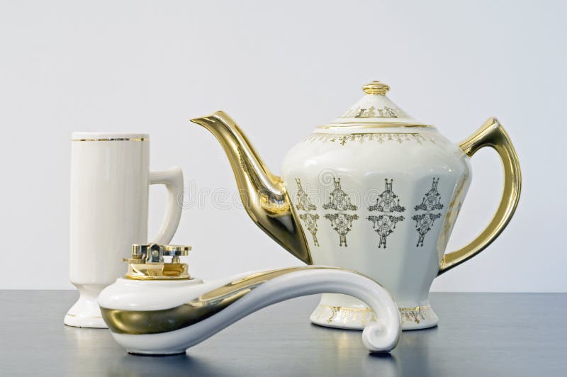 Teapot, mug and lighter stock image. Image of shaped, graceful 4543313